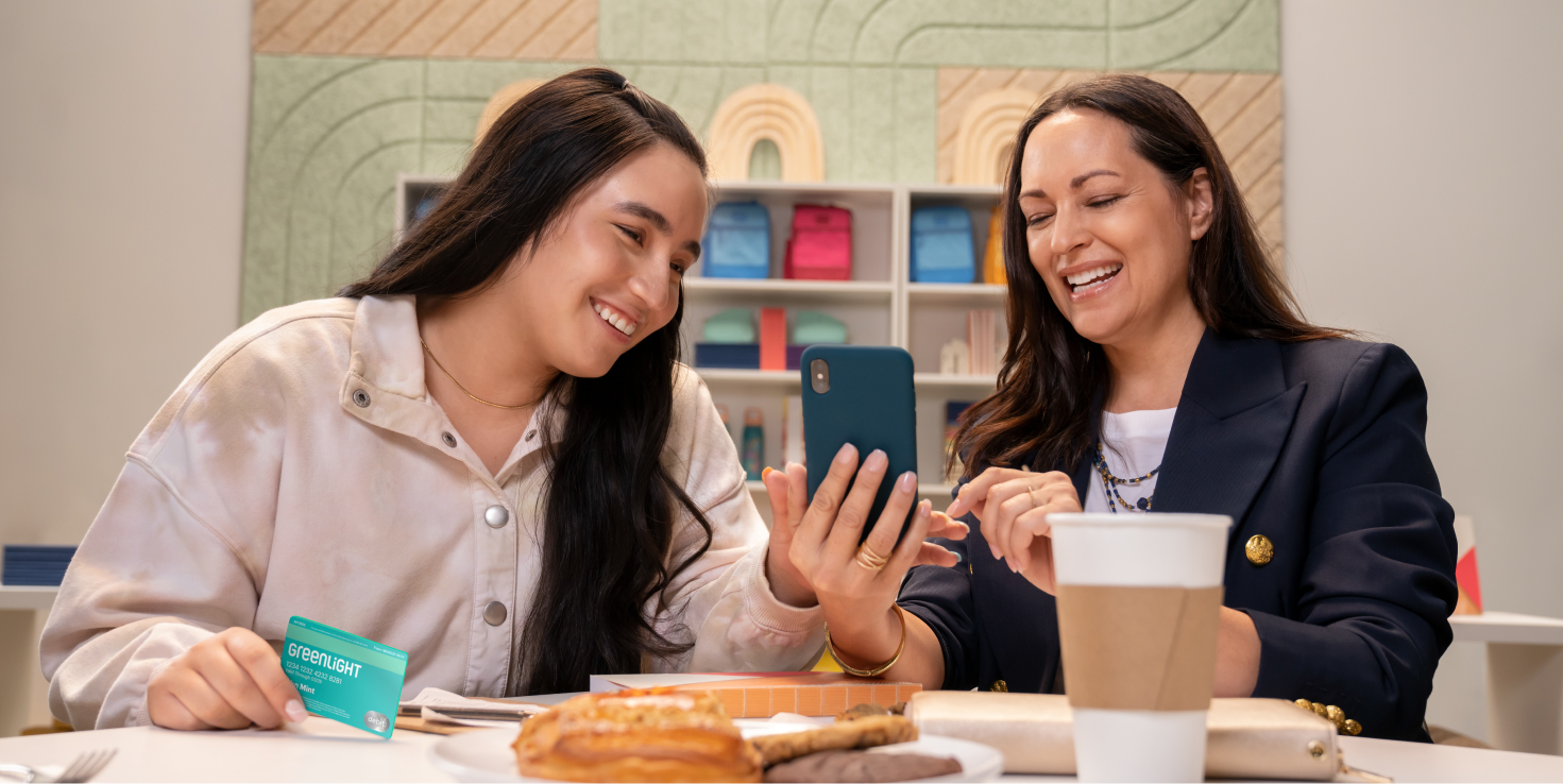 Mother and teenage daughter talking about Greenlight accounts.