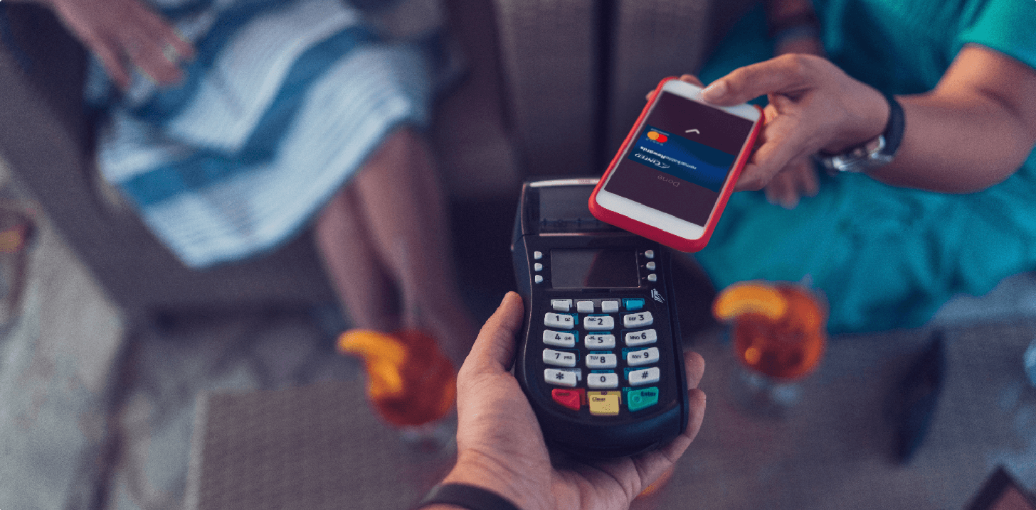 Shopper scanning a purchase using the Cinfed Digital Wallet app on her smart phone.