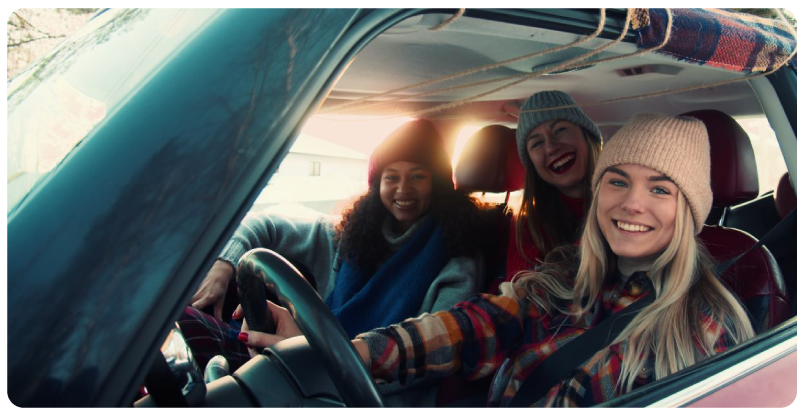 Friends driving in car