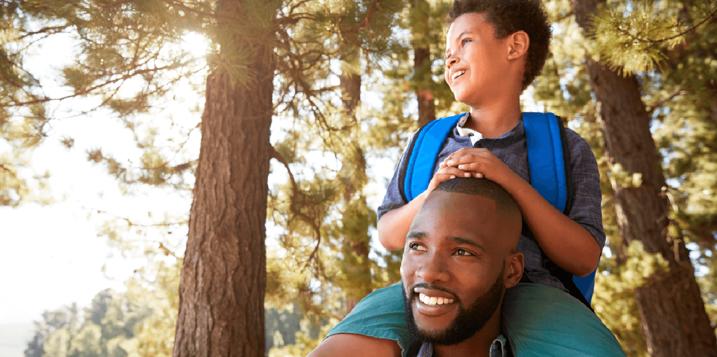 Young father and son playing in the park.